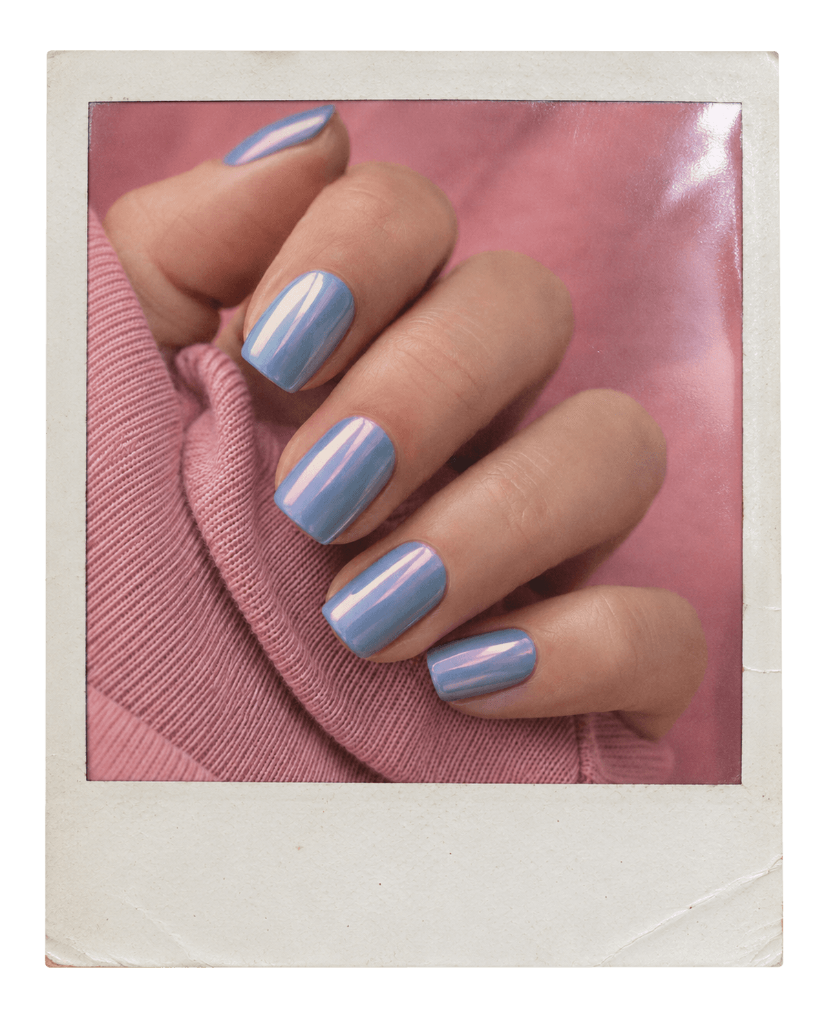 Vintage instant photo of baby-blue chrome nails against a pink sleeve.